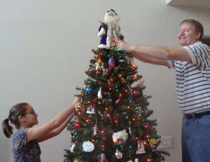 My daughter & husband decorating the tree.