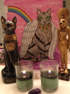 Candles to Bastet for a new cat with "The Cat" card from my "Egyptian Lenormand" in the background.