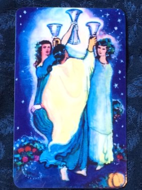 The 3 of Cups from "The Illuminated Starlight Tarot," by Carol Herzer.
