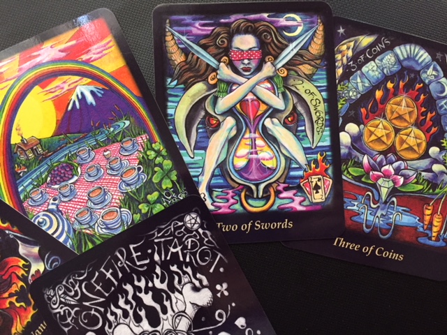 The 10 of cups, 2 of Swords & 3 of Coins from The Bonefire Tarot by Gabi Angus-West. For readings visit http://magickal-musings.com. If you are a publisher seeking a reviewer feel free to email me at: IsisRaAnpu@gmail.com.